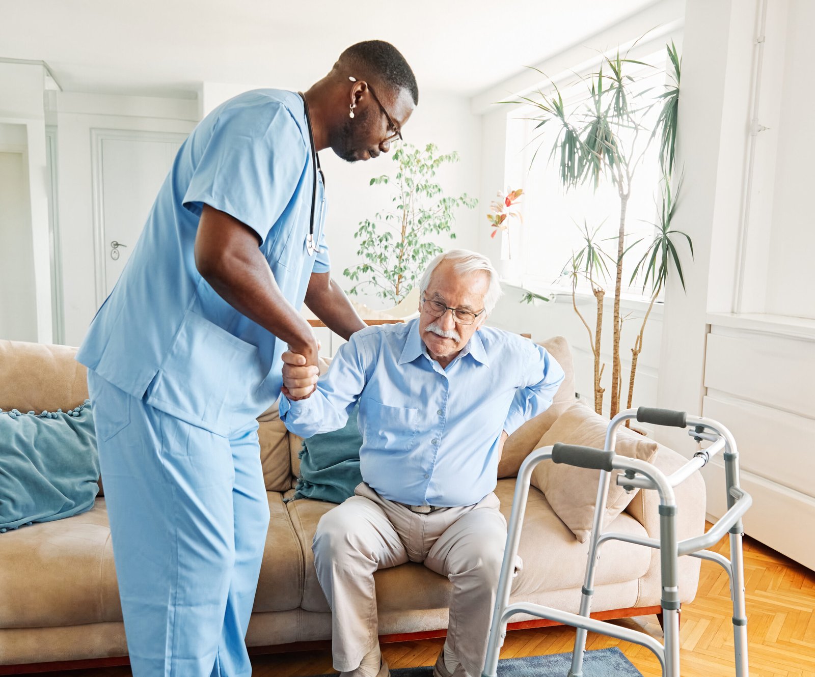 Nurse taking blood pressure at home